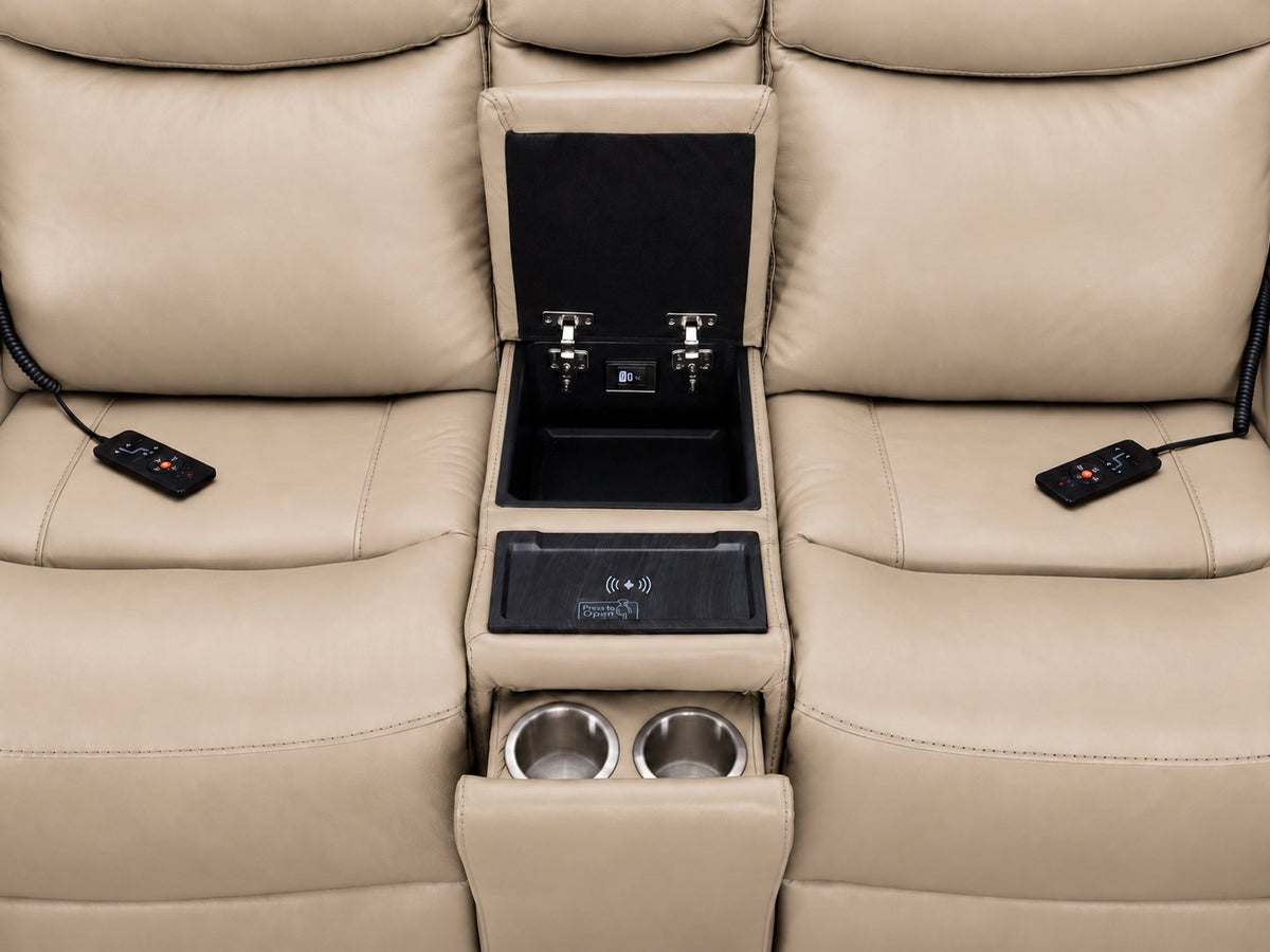Jackson pristine loveseat console close-up showing open storage, wireless charging pad, dual cupholders and remotes