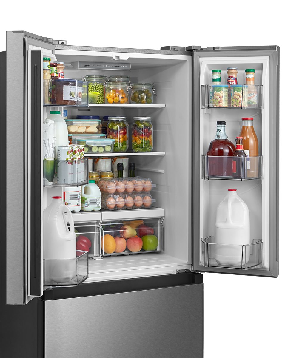Close-up of stocked refrigerator shelves, door bins and produce drawers