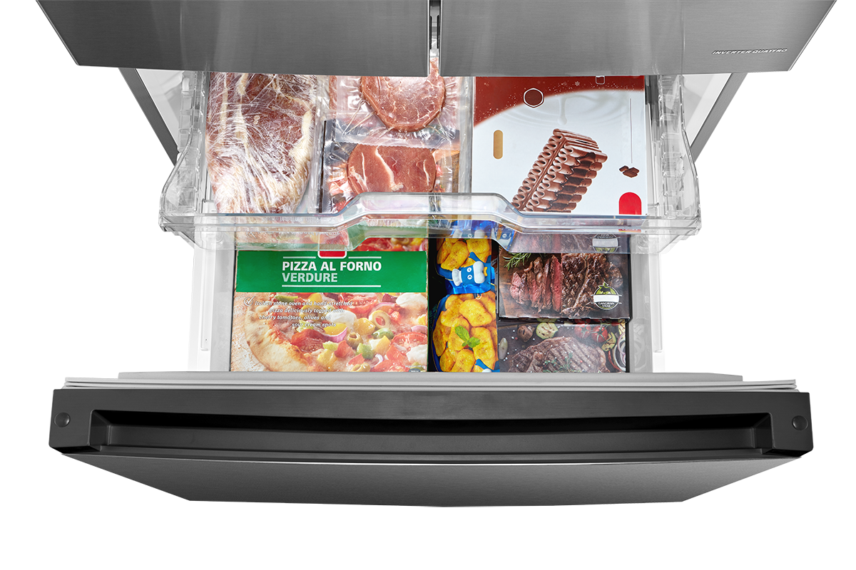 Bottom freezer drawer loaded with frozen foods in upper and lower storage sections