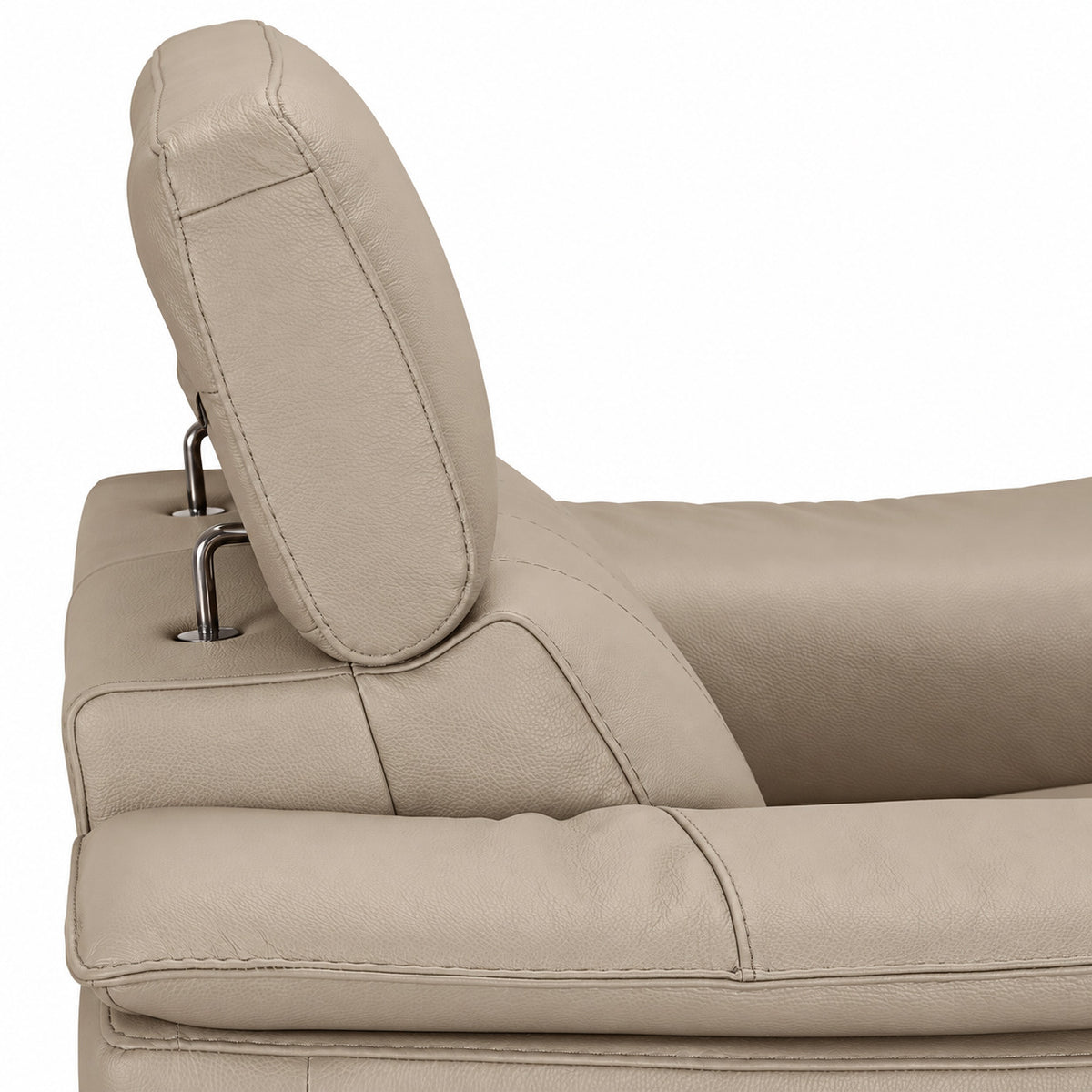 Close-up of the adjustable headrest supports and tan leather upholstery