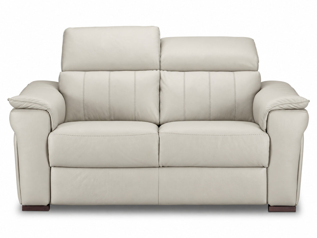 Loveseat with one headrest raised and the other lowered to show adjustable positioning
