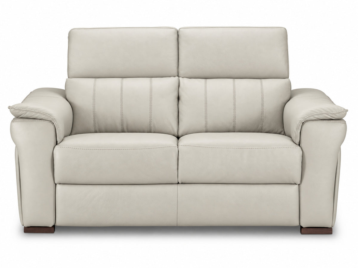 Front view highlighting the loveseat's stitched back cushions and deep cream leather seats