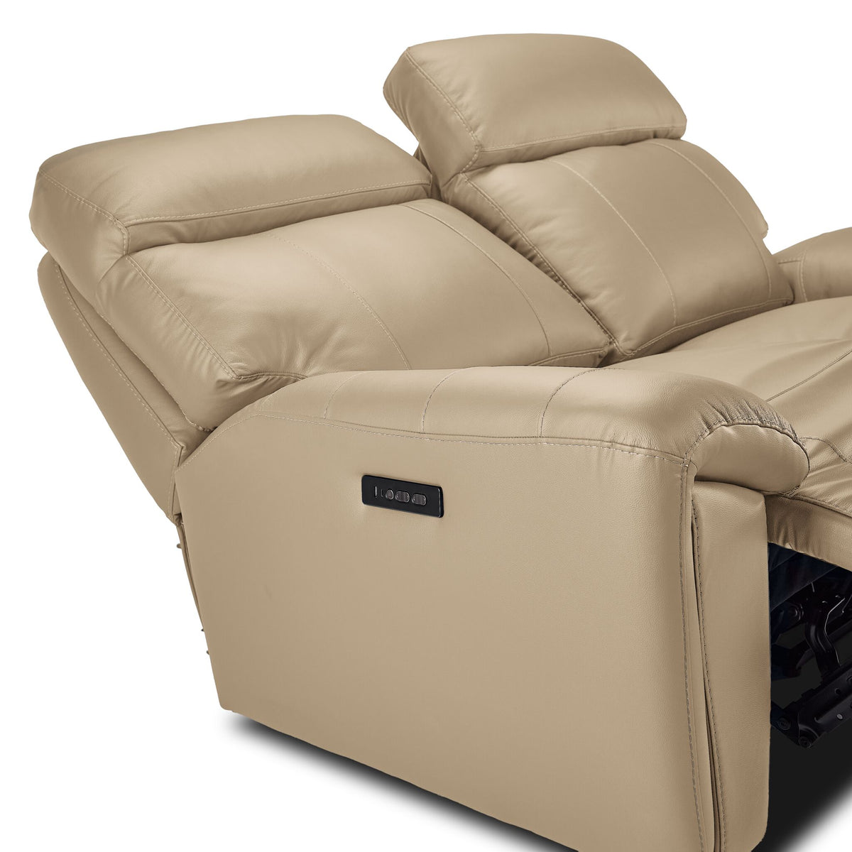 Apollo beige leather loveseat close-up showing adjustable headrests, padded arm and side-mounted power controls