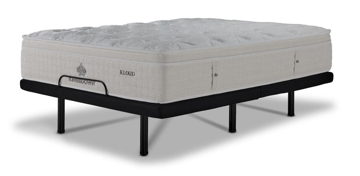 Kingsdown Atmosphere Firm Euro Top Queen Mattress on flat L2 Lux Adjustable Base, shown from a three-quarter view.