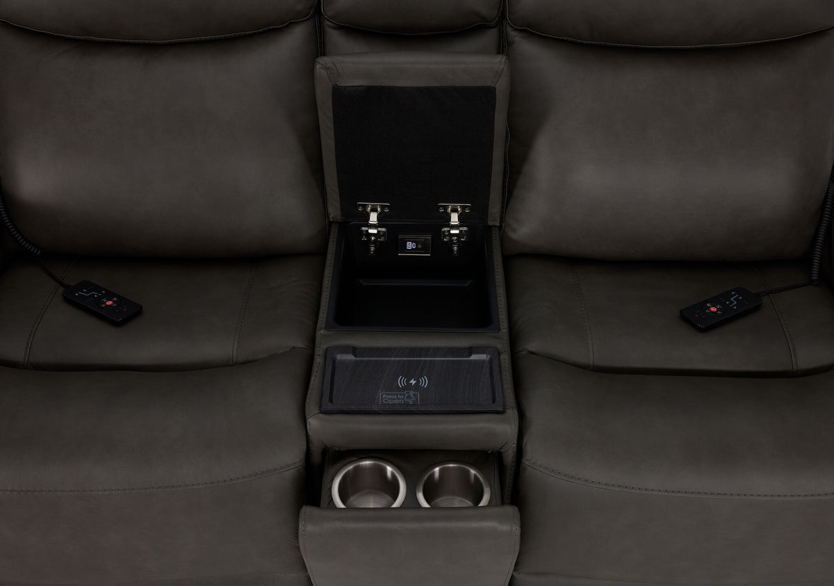 Jackson loveseat centre console close-up showing storage, wireless charging pad and two hidden cupholders