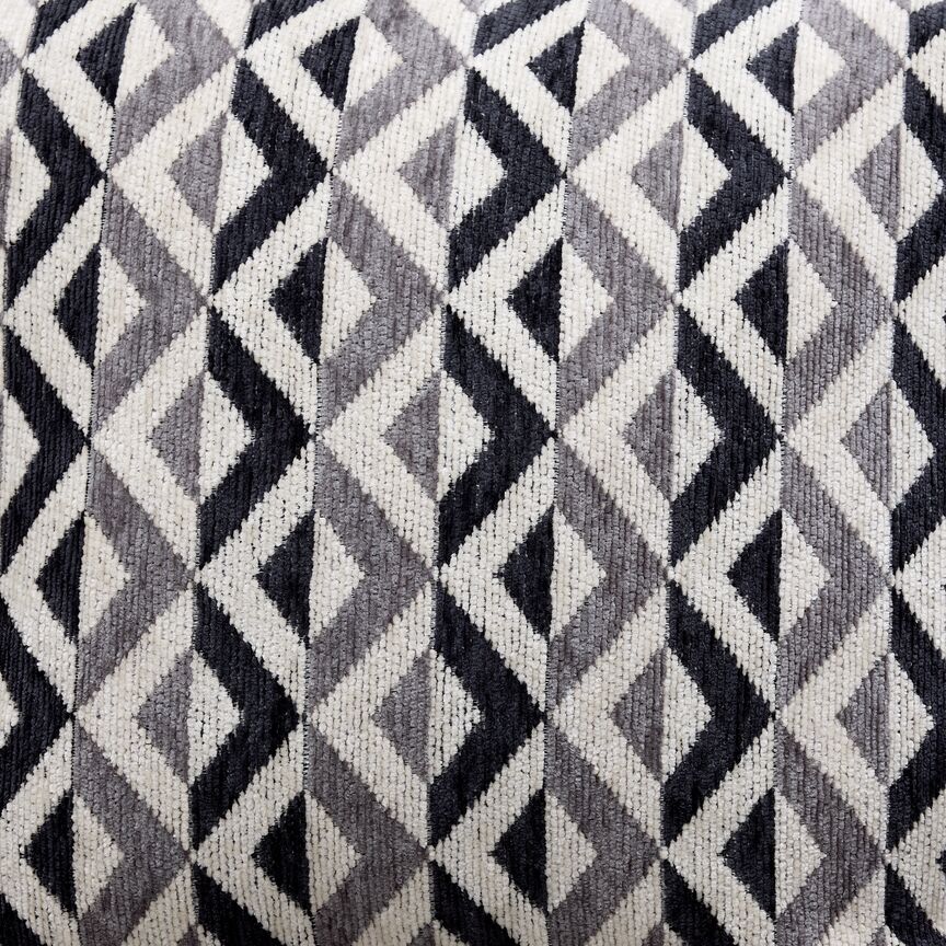 Jupiter Sectional accent pillow close-up showing a black, white and grey geometric fabric pattern