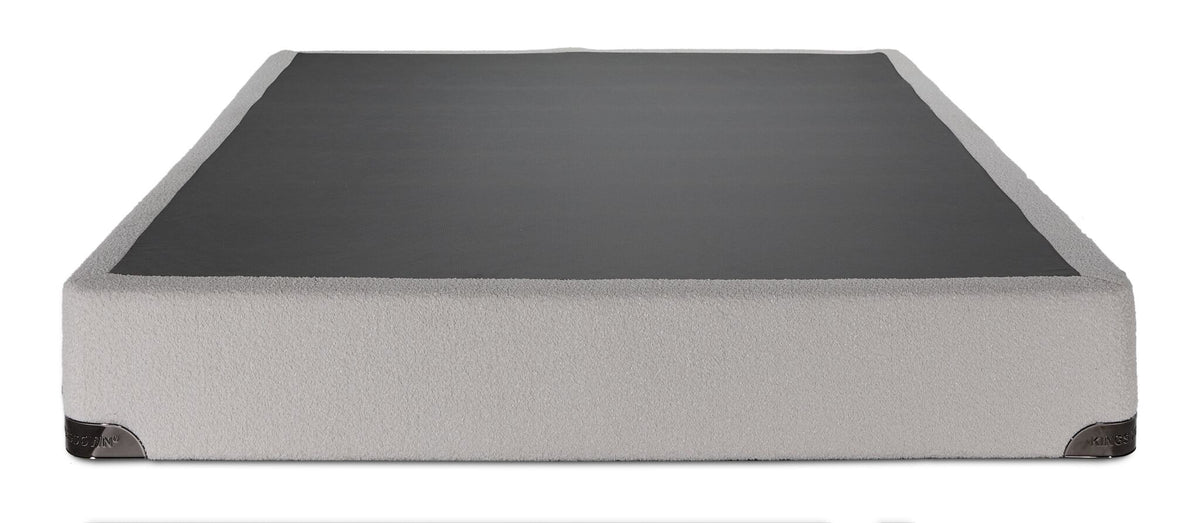 Front view of the Kingsdown split boxspring showing white boucle upholstery and black top panel