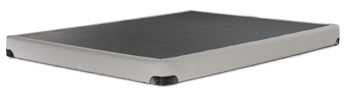 Kingsdown White Boucle twin low-profile boxspring with beige polyester upholstery and black support surface, angled view