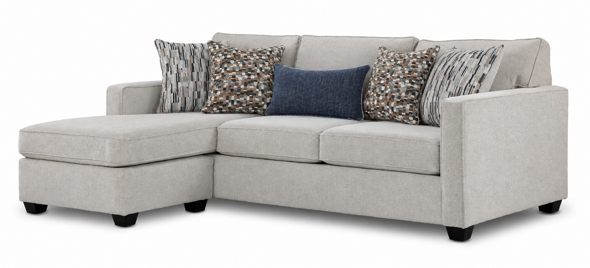 Laila reversible sofa chaise in beige polyester with transitional styling, patterned pillows and left-side chaise