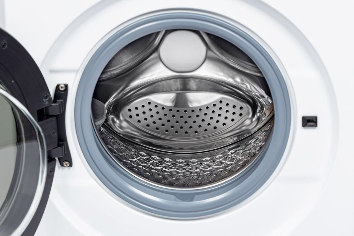 Close-up of the stainless steel dryer drum and perforated interior surface