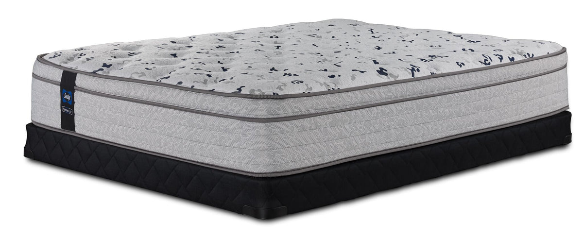 Sealy Comfort Series 1 Queen firm mattress on a black low-profile boxspring with quilted Euro top