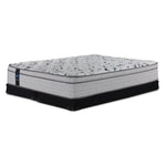 Sealy Comfort Series 2 King medium mattress on two black low-profile split boxsprings