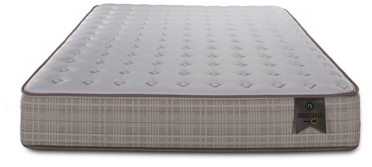 Front view of the King mattress showing its tufted surface, brown edge piping and Origins label
