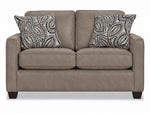 City Leather Loveseat - Stone front view with two seat and back cushions, slim track arms, dark wood legs and two patterned accent pillows