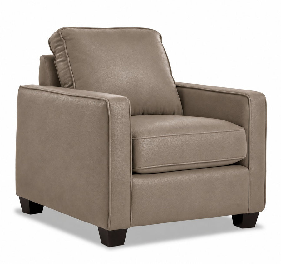 City Leather Chair - Stone in a three-quarter view with a cushioned seat and back, slim track arms and dark wood legs