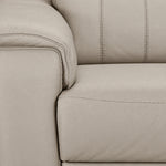 Close-up of light grey leather texture, stitching, armrest and seat cushion