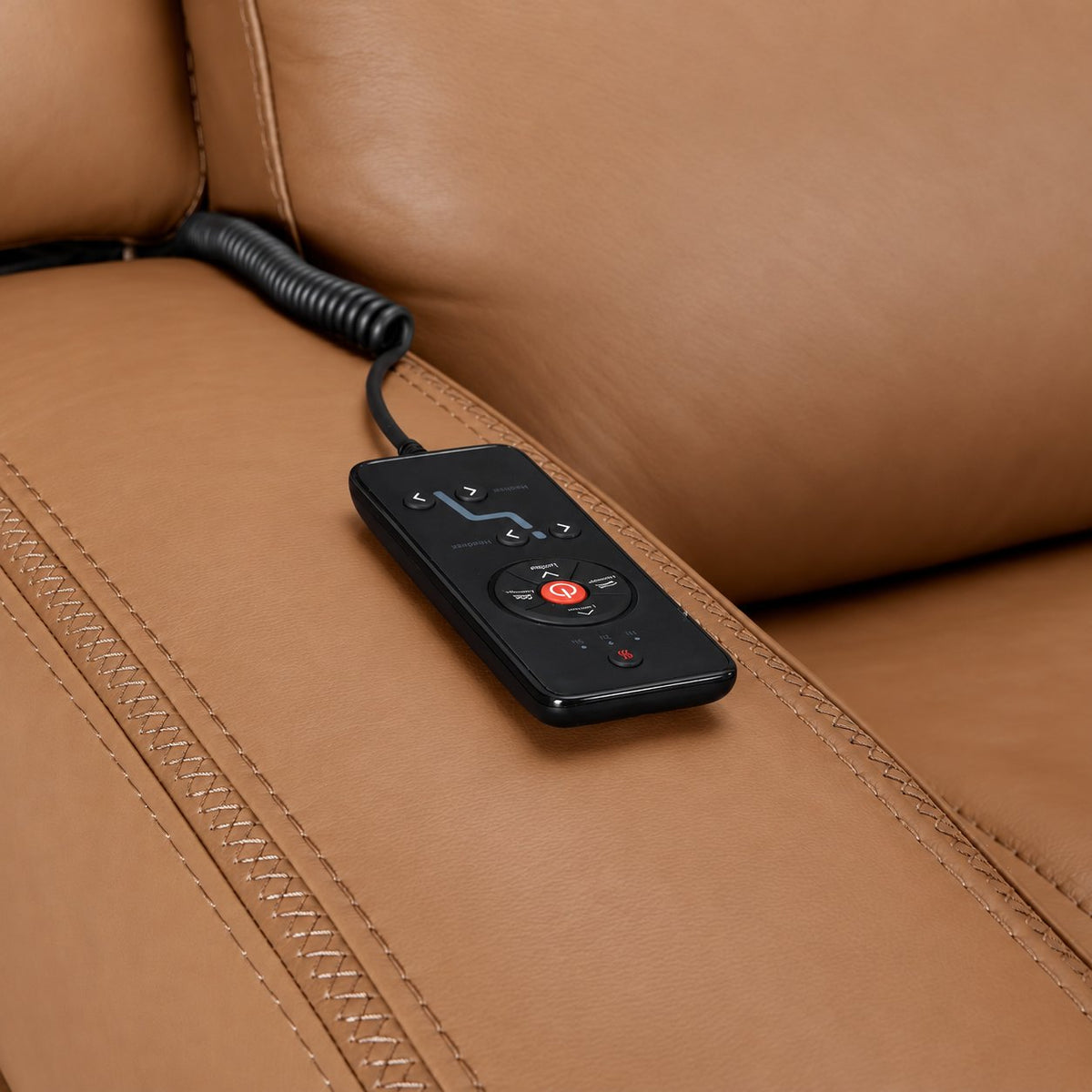 Jackson butternut leather recliner close-up showing wired remote for power recline, heat and massage controls