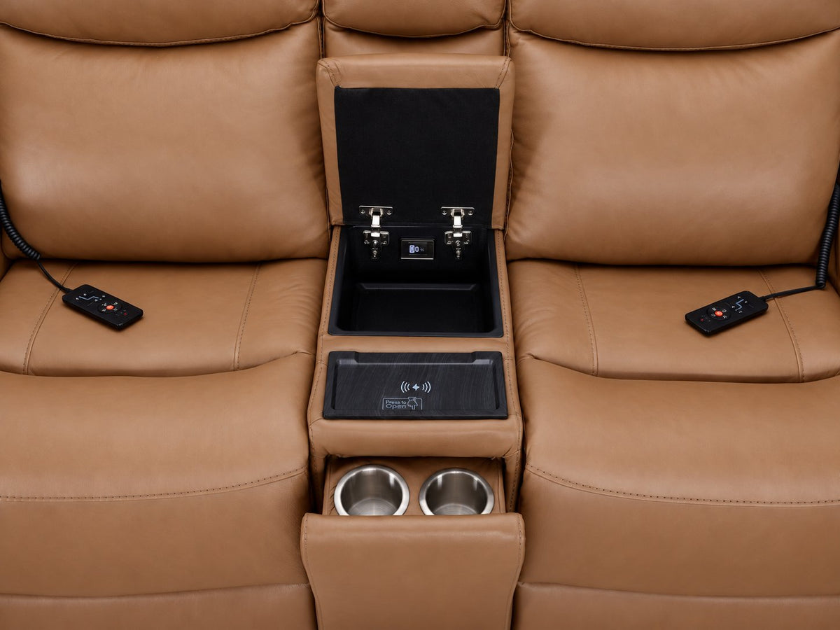 Jackson loveseat centre console close-up showing open storage, wireless charging pad, dual cupholders and remotes