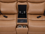 Jackson loveseat centre console close-up showing open storage, wireless charging pad, dual cupholders and remotes