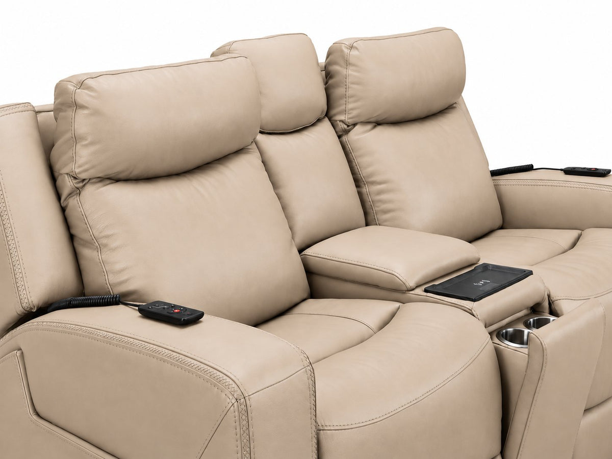 Jackson pristine leather loveseat close-up showing padded seats, wired remotes, wireless charging pad and cupholders