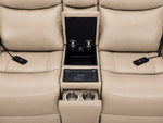 Jackson loveseat centre console close-up showing open storage, wireless charging pad, cupholders and remotes