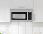 Stainless steel Midea microwave installed above a white tile backsplash between kitchen cabinets