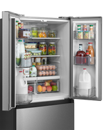 Close-up of stocked refrigerator shelves, door bins and produce drawers