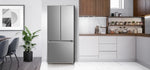 Stainless steel Midea French door refrigerator installed in a modern white kitchen