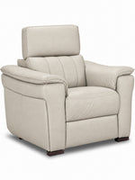 Matching cream leather chair with wide padded arms, deep seat and adjustable headrest