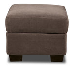 Front view of Archie Ottoman in textured ash fabric with a plush rectangular cushion and dark wood feet.