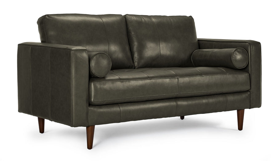Bari Leather Loveseat in charcoal shown from a three-quarter angle with tufted seat, two back cushions, bolster pillows and tapered wood legs