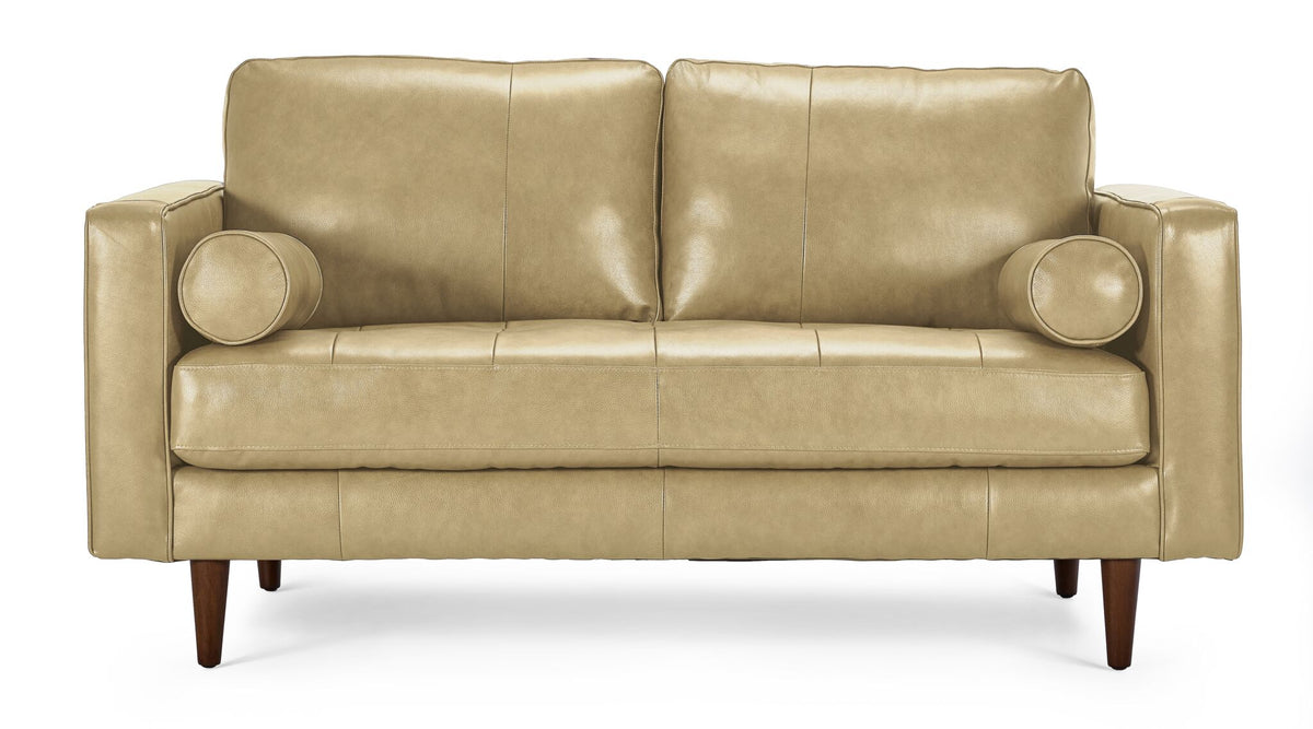 Front view of Bari Leather Loveseat in stone with two cushioned backrests, tufted bench seat, bolster pillows and tapered wood legs