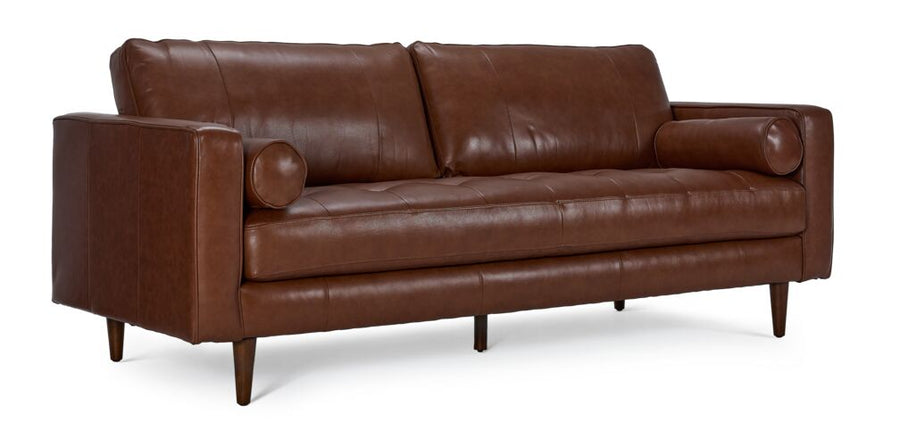 Bari Leather Sofa in cobblestone brown, shown at an angle with tufted seat, two bolster pillows, track arms and tapered wood legs