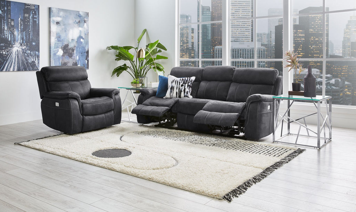 Haven grey reclining sofa and matching recliner with footrests extended in a living room