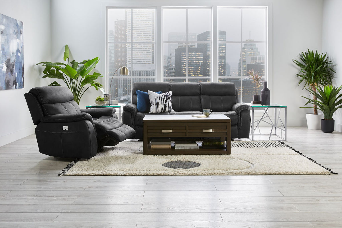 Haven grey reclining sofa and matching recliner in a living room with coffee table