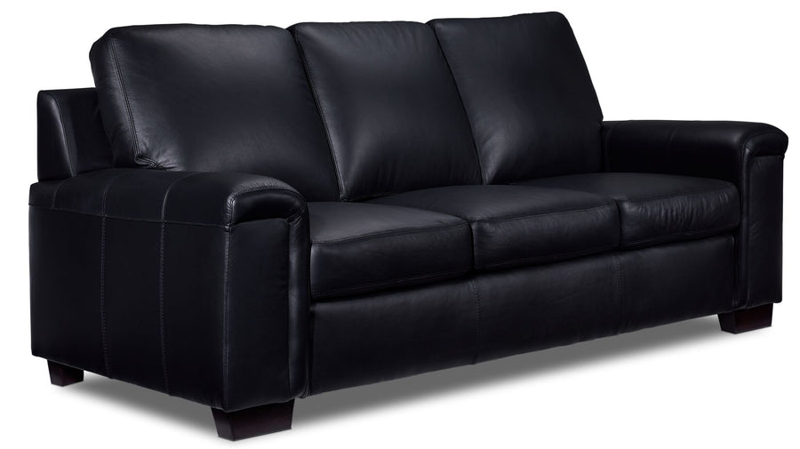 Icon Leather Sofa - Black, angled view with three seat cushions, padded arms and dark wood feet