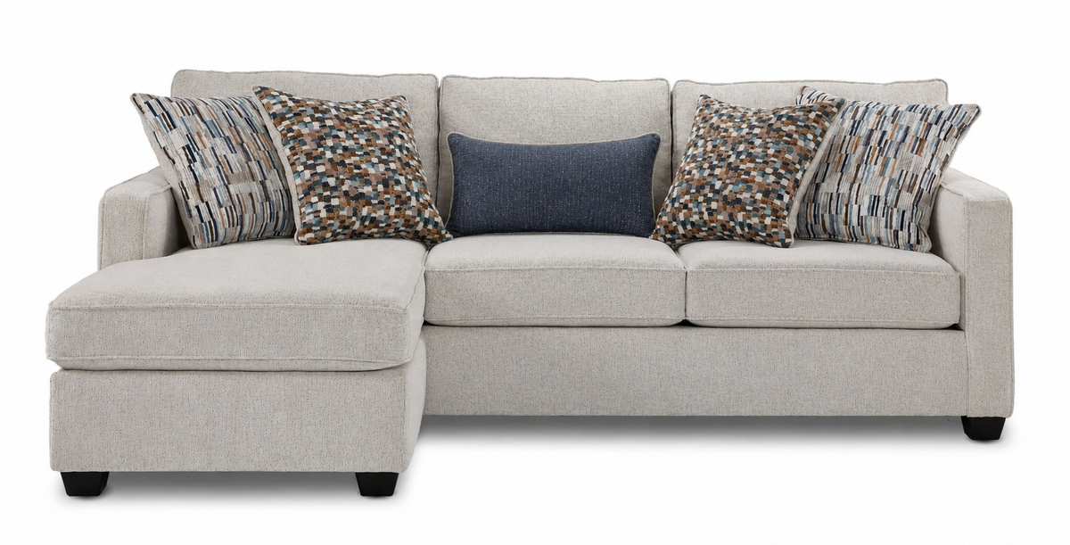 Front view of Laila beige polyester sofa chaise with patterned accent pillows and chaise positioned on the left