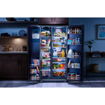 Maytag side-by-side refrigerator in a kitchen with open doors, LED lighting and stocked shelves