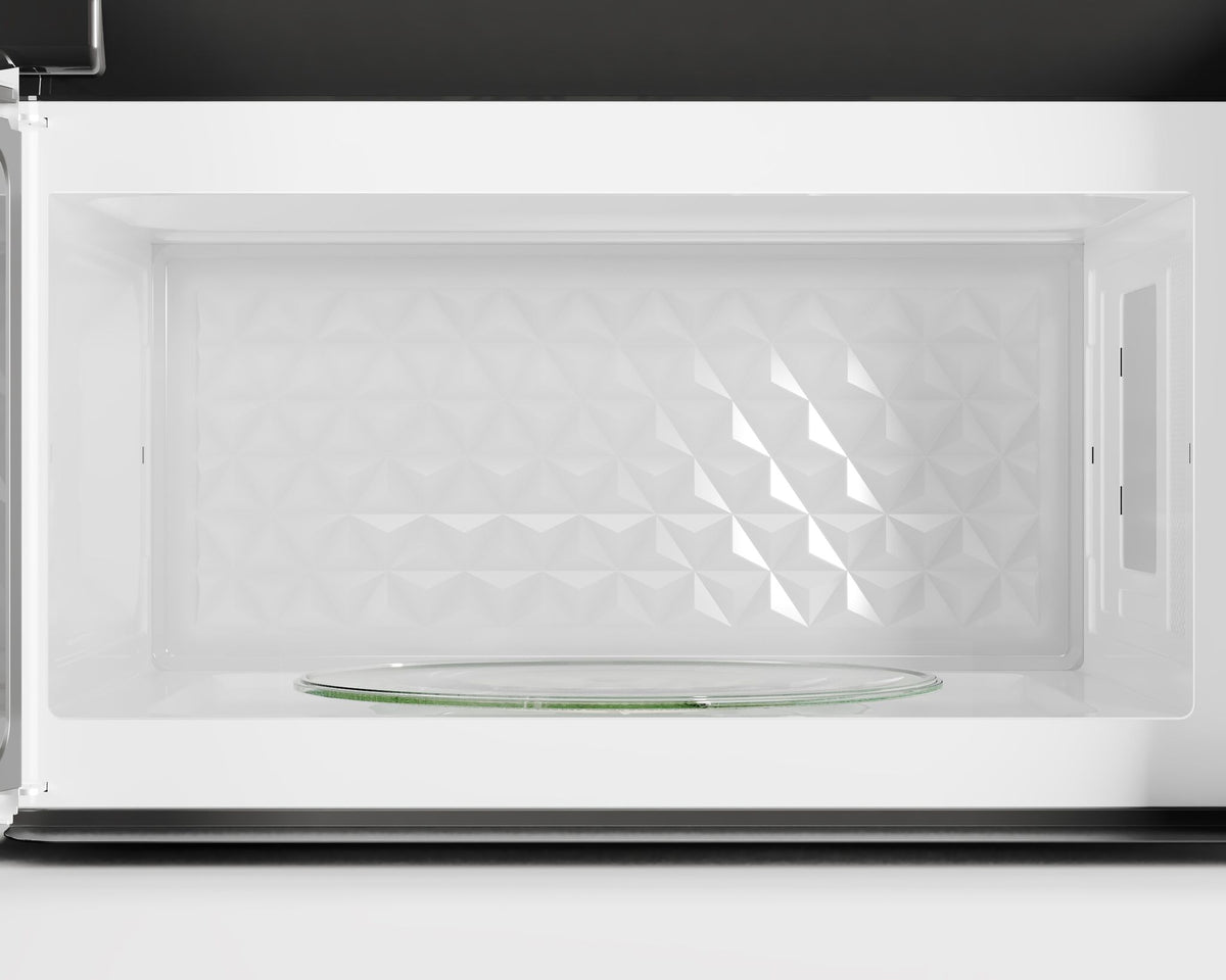 Close-up of the white microwave interior with glass turntable and textured back wall
