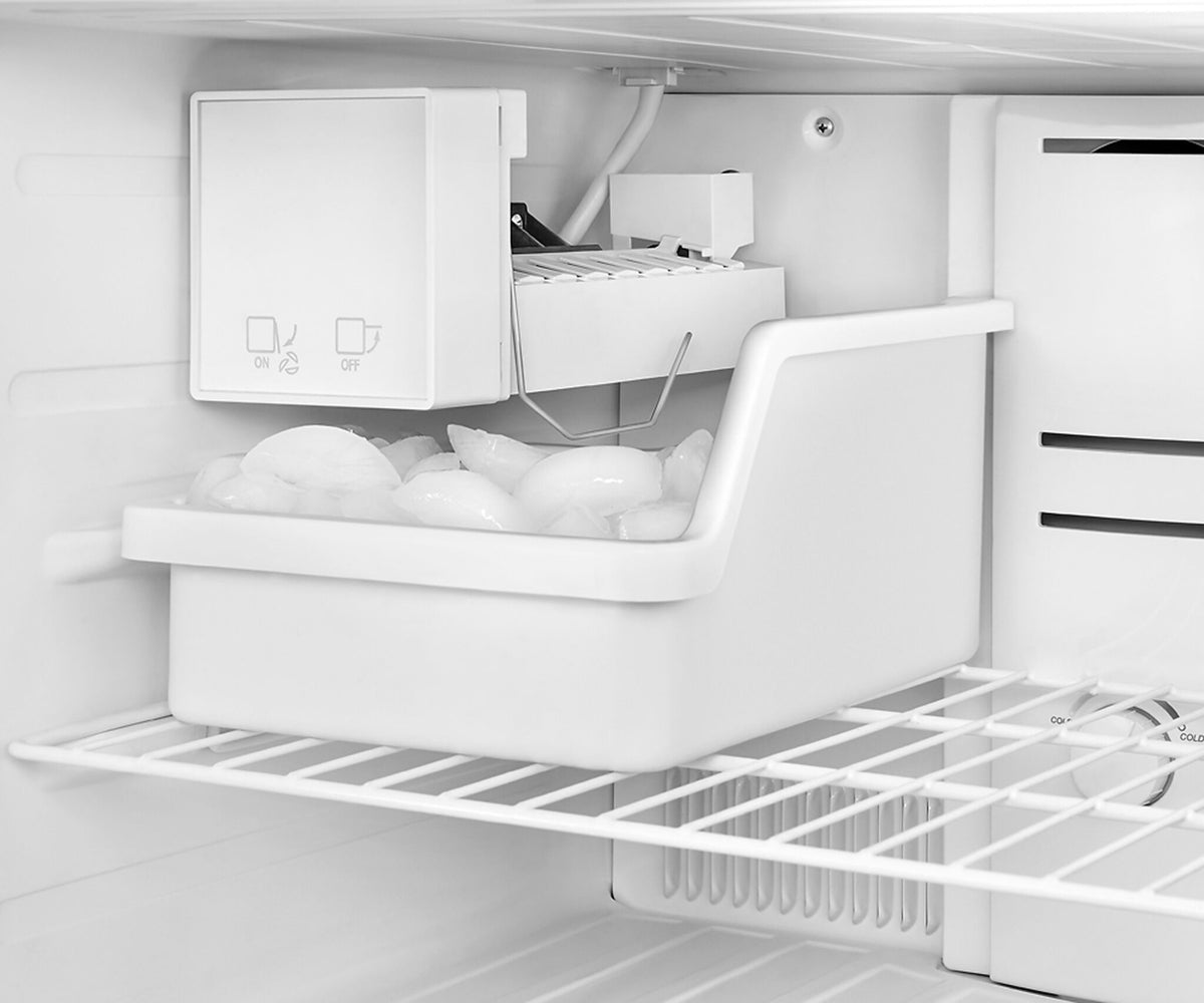 Freezer ice maker and storage bin filled with ice cubes