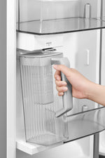 Removable door-mounted water pitcher beneath the internal water dispenser