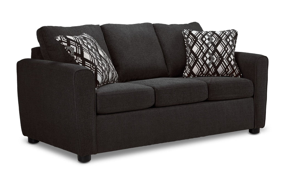 Nichols Sofa - Grey angled view with three seat cushions, plush back cushions and two patterned accent pillows