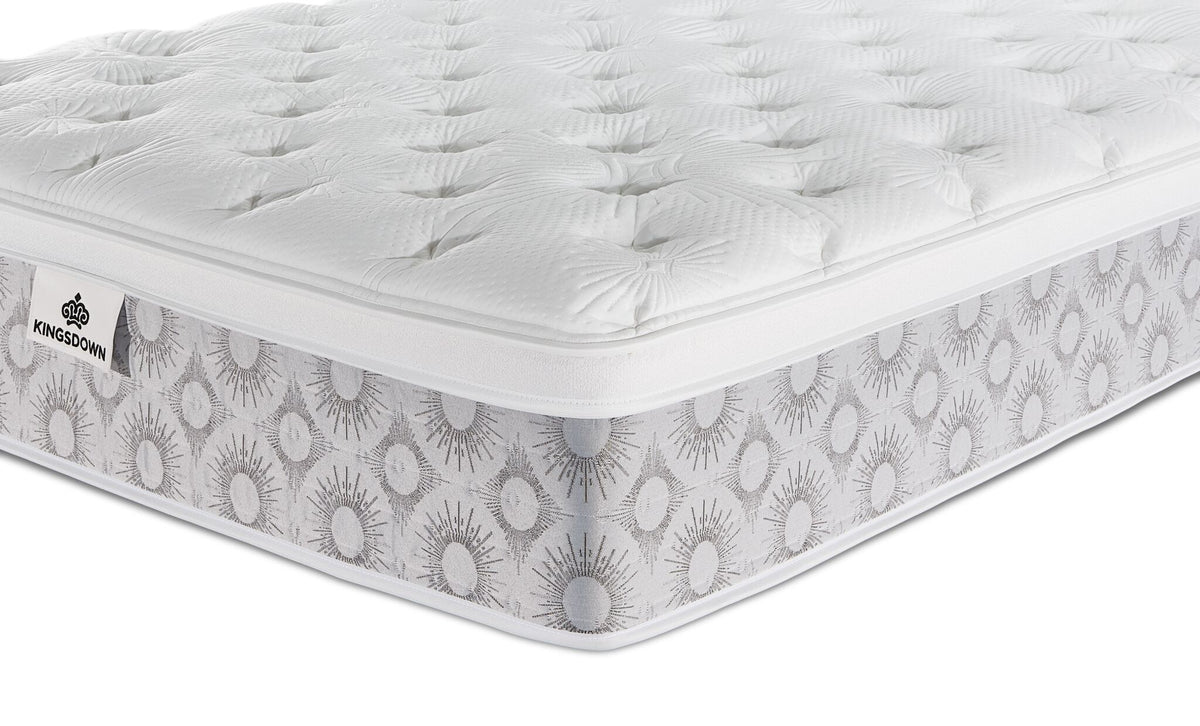 Close-up of the Kingsdown Quinlan Plush Euro Top Full XL mattress showing the tufted top and patterned side