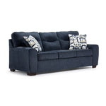 Mackay blue sofa with curved arms, three seat cushions, accent pillows and angled front view