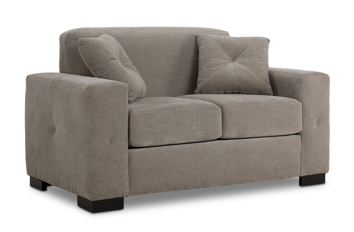 Valetta Loveseat - Wheat angled view with wide track arms, two seat cushions, dark block feet and two accent pillows