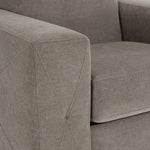 Valetta wheat upholstery close-up showing textured fabric and decorative cross stitching on the wide track arm