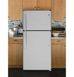 GE stainless steel top-freezer refrigerator in a modern kitchen with compact fresh and frozen food storage.