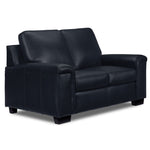 Icon Leather Loveseat - Navy angled view with two cushioned seats, padded arms and dark wood feet