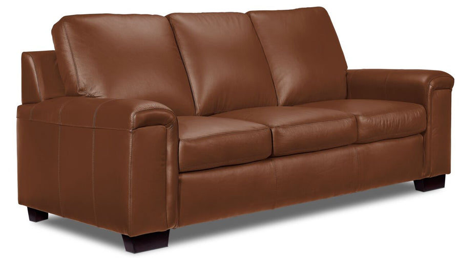 Icon Leather Sofa - Saddle angled view with three cushioned seats, padded arms and dark wood feet